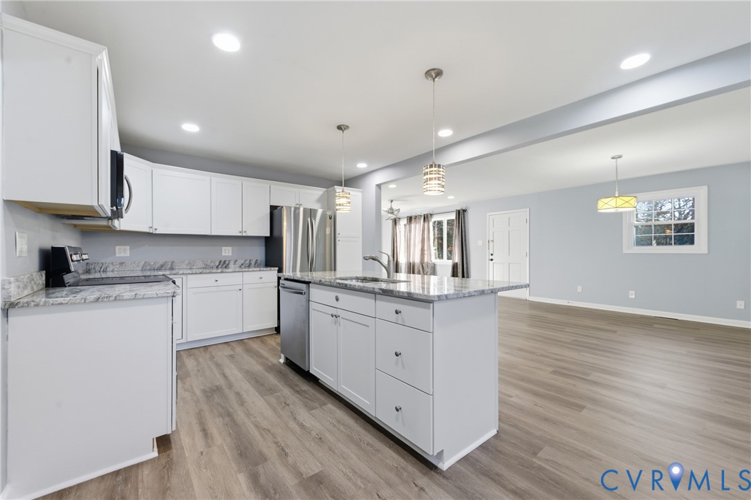11008 Ryall Road Glen Allen, VA 23059 - Photo 10 of 25 a kitchen with granite countertop white cabinets and white appliances