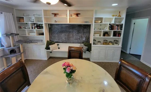 a bathroom with a granite countertop sink toilet and mirror