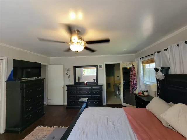 a bedroom with bed and a couch