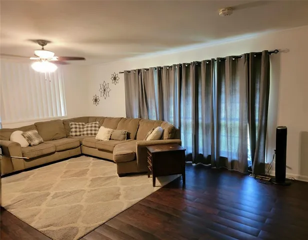 a kitchen with a sink appliances and cabinets