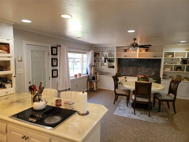 a kitchen with stainless steel appliances a sink a stove and cabinets