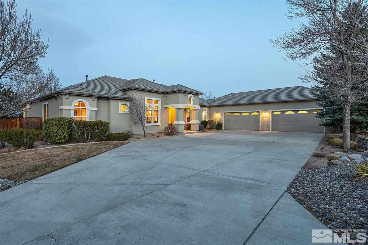 5278 North Elk River Road Reno, NV 89511 - Photo 1 of 30 a front view of a house with a yard and trees
