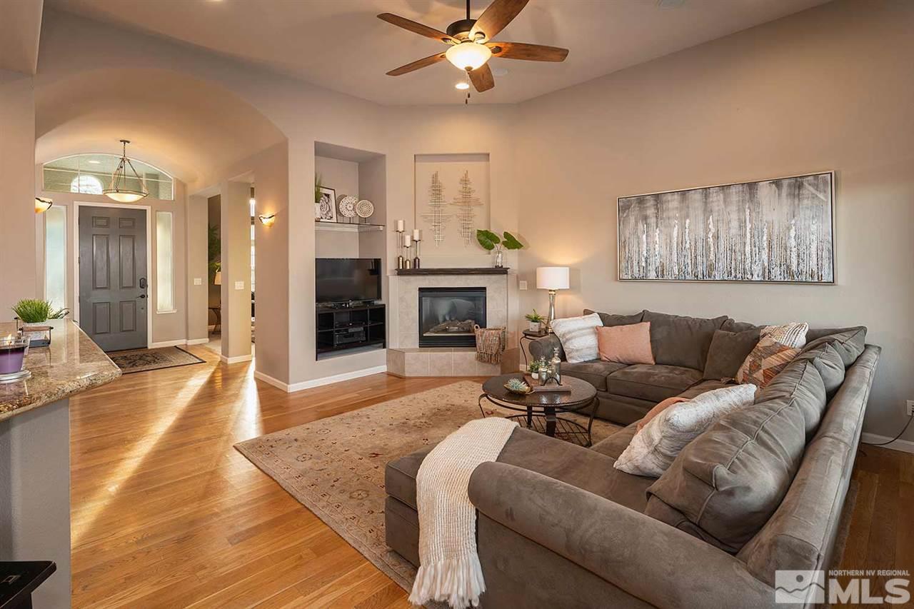 5278 North Elk River Road Reno, NV 89511 - Photo 14 of 30 a living room with furniture and a fireplace