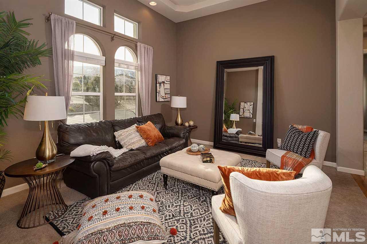 5278 North Elk River Road Reno, NV 89511 - Photo 19 of 30 a living room with furniture and a large window