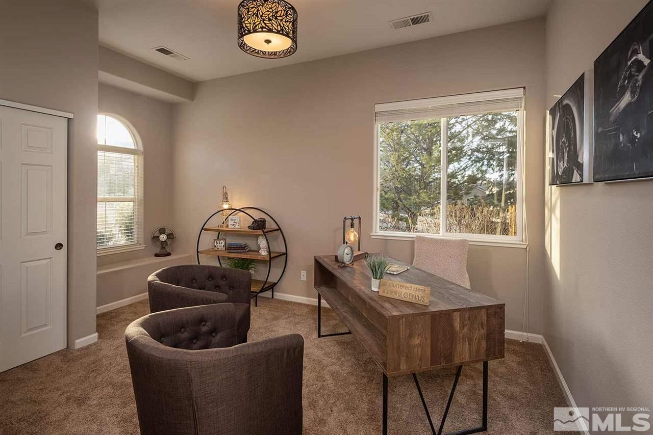 5278 North Elk River Road Reno, NV 89511 - Photo 24 of 30 a living room with furniture and a window