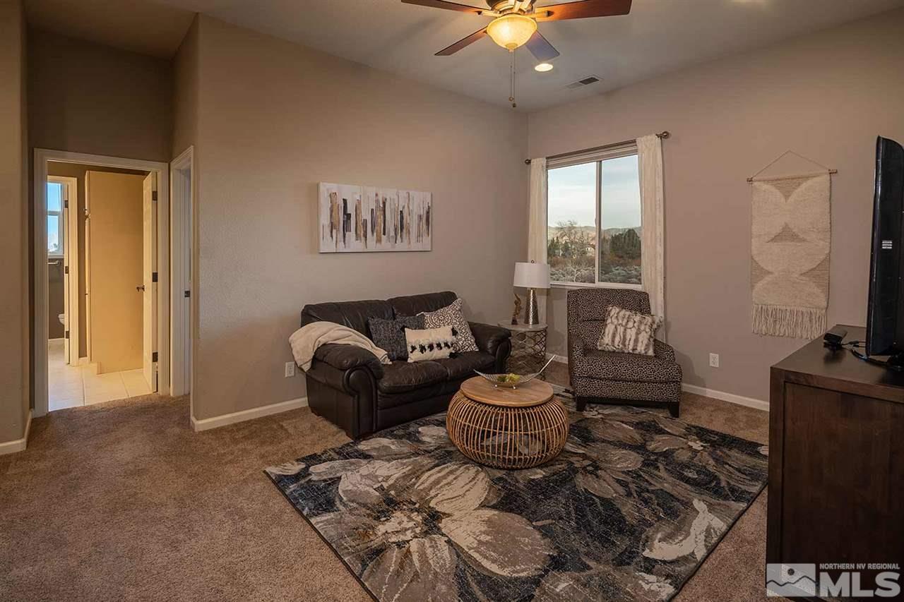5278 North Elk River Road Reno, NV 89511 - Photo 25 of 30 a living room with furniture and a flat screen tv
