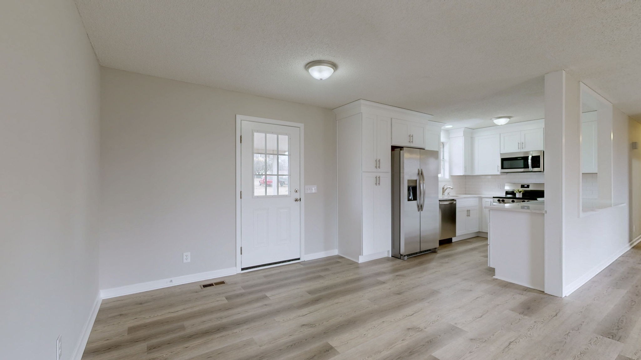 211 Freedom Drive Lebanon, TN 37087 - Photo 13 of 41 a view of kitchen with refrigerator stove and wooden floor