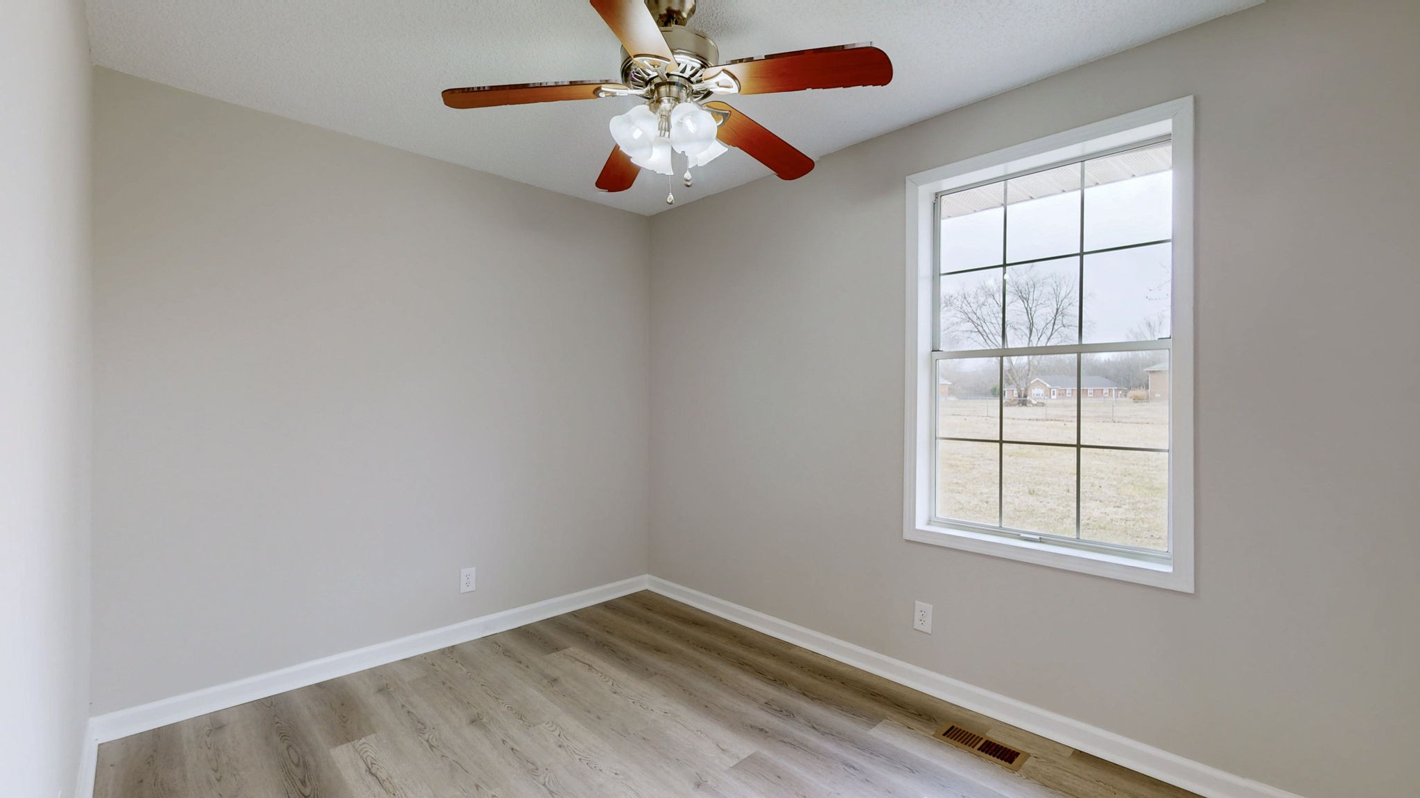 211 Freedom Drive Lebanon, TN 37087 - Photo 17 of 41 an empty room with windows and fan