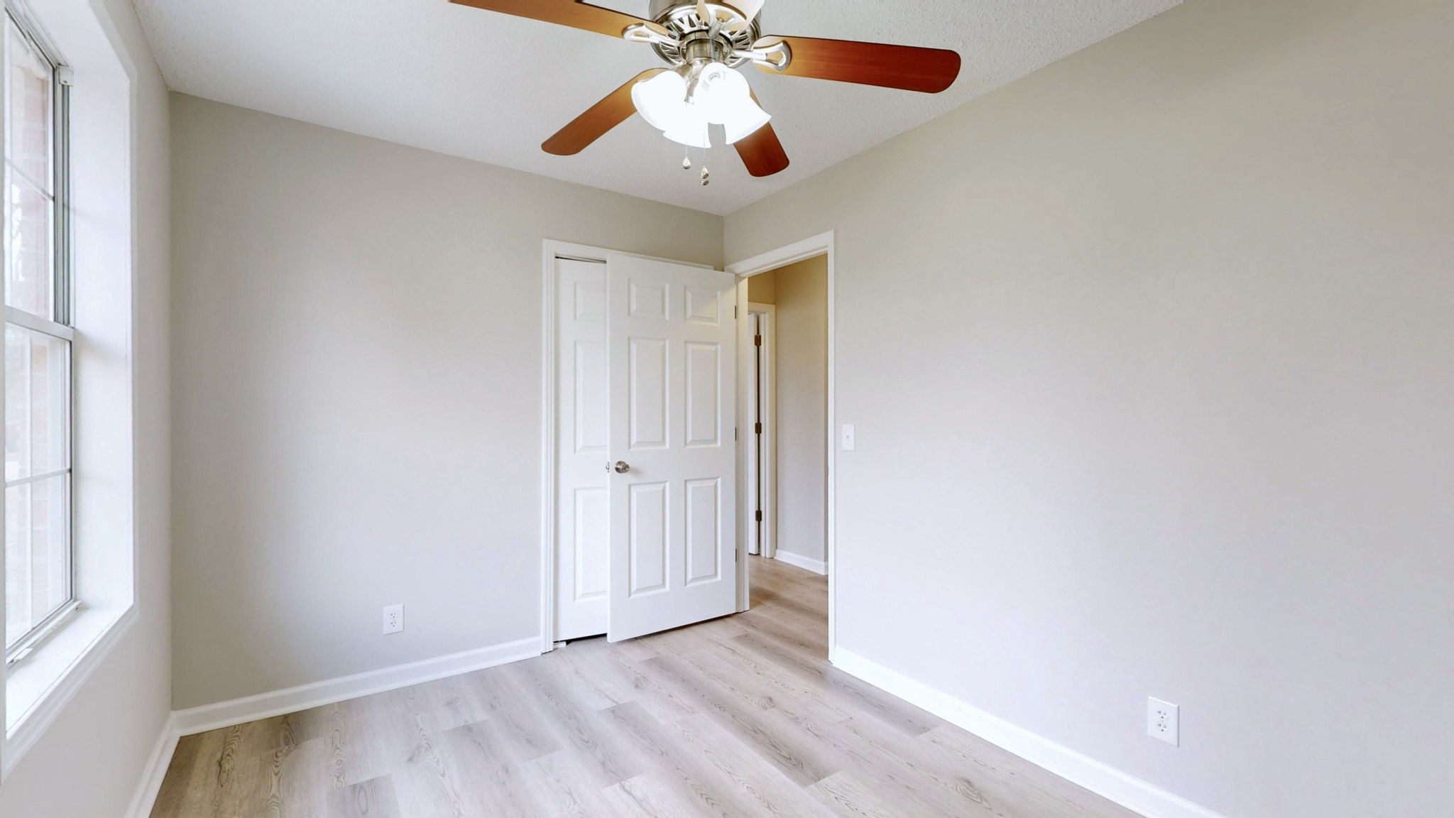 211 Freedom Drive Lebanon, TN 37087 - Photo 18 of 41 an empty room with windows and fan