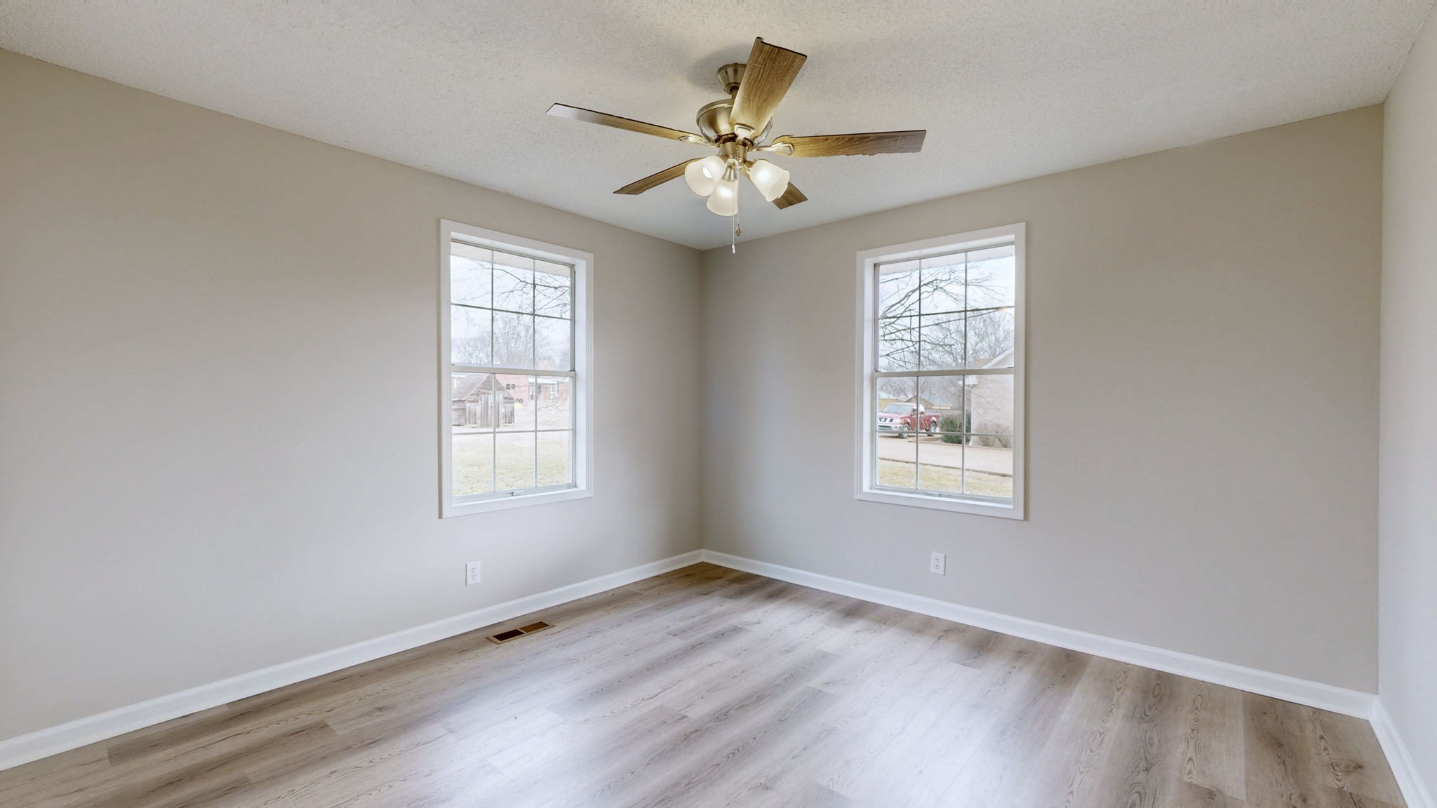 211 Freedom Drive Lebanon, TN 37087 - Photo 19 of 41 a view of an empty room with wooden floor and a window