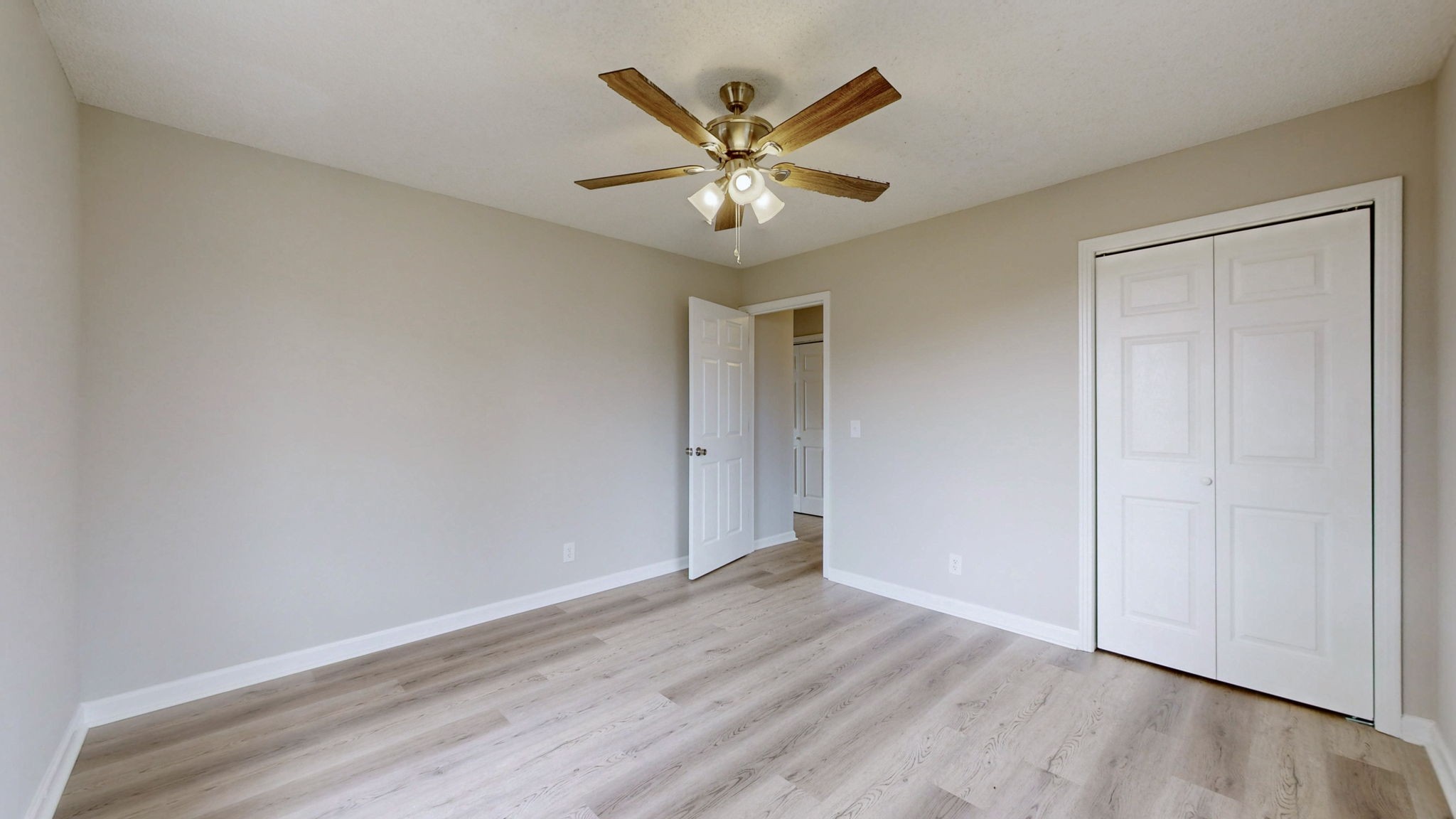 211 Freedom Drive Lebanon, TN 37087 - Photo 20 of 41 an empty room with wooden floor and ceiling fan