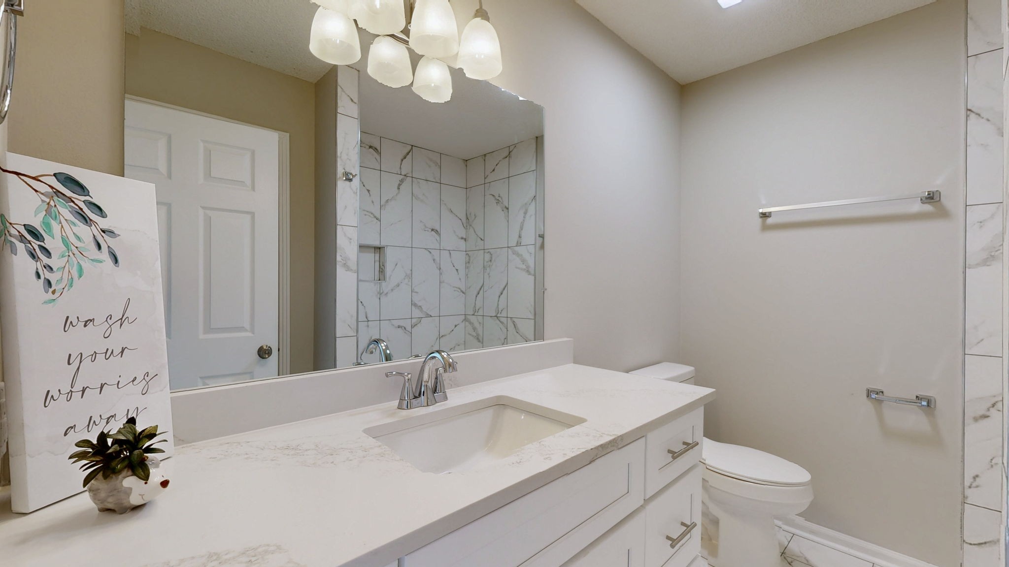 211 Freedom Drive Lebanon, TN 37087 - Photo 21 of 41 a bathroom with a granite countertop sink a toilet and a mirror