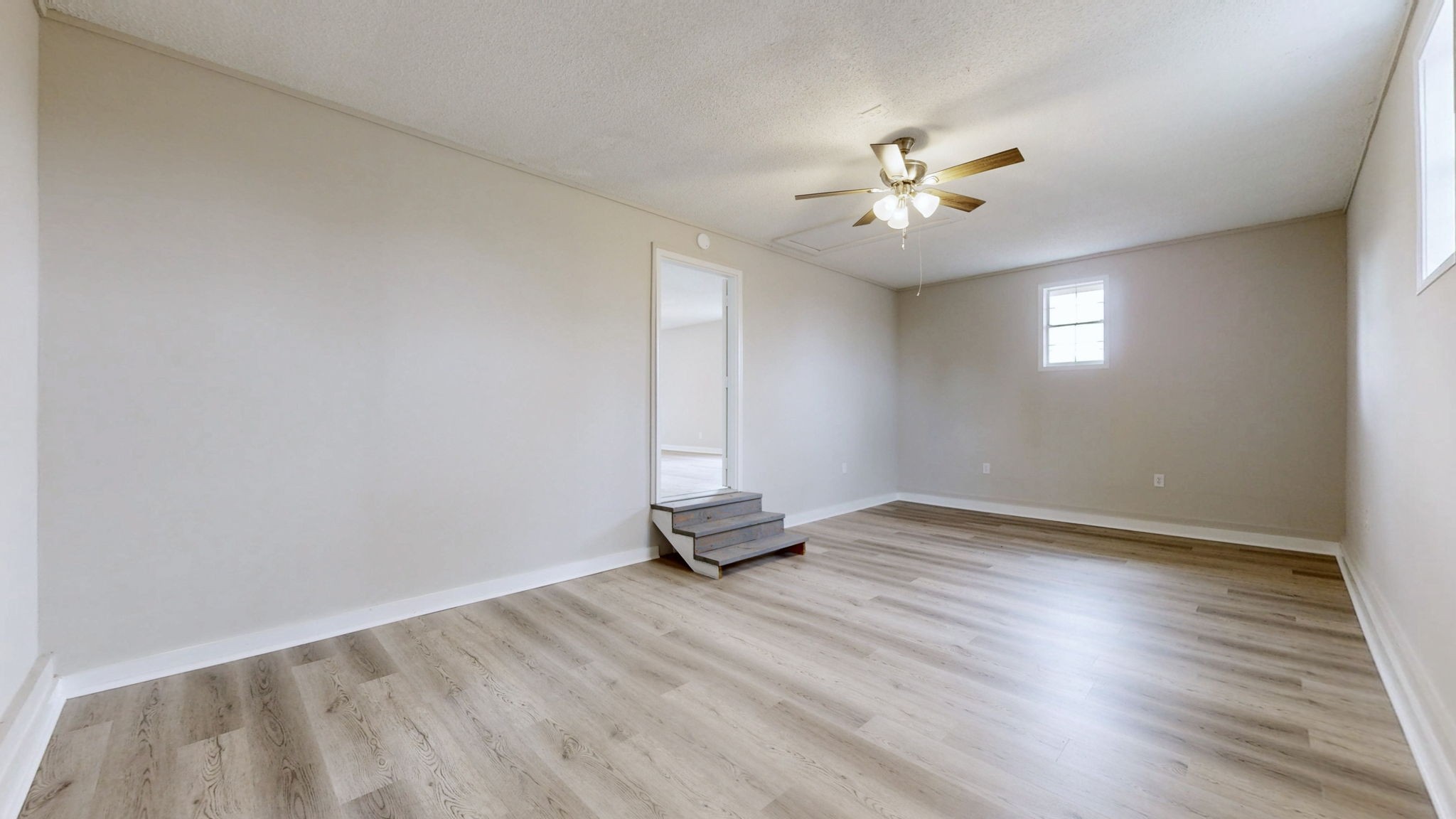211 Freedom Drive Lebanon, TN 37087 - Photo 28 of 41 a view of an empty room with window and wooden floor