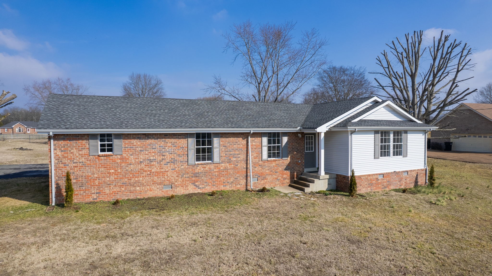 211 Freedom Drive Lebanon, TN 37087 - Photo 3 of 41 a front view of a house with garden