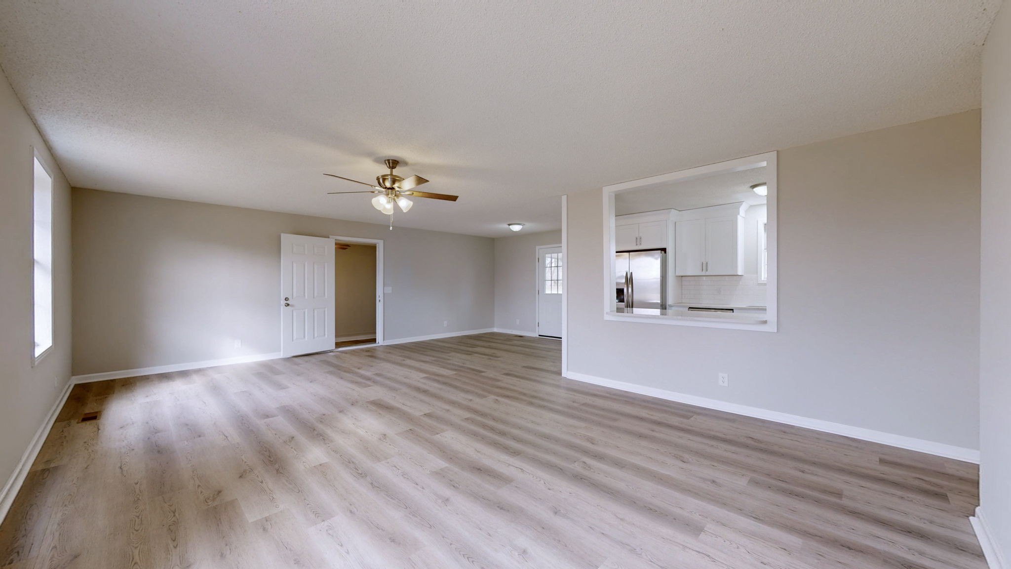 211 Freedom Drive Lebanon, TN 37087 - Photo 8 of 41 a view of an empty room with wooden floor and a window
