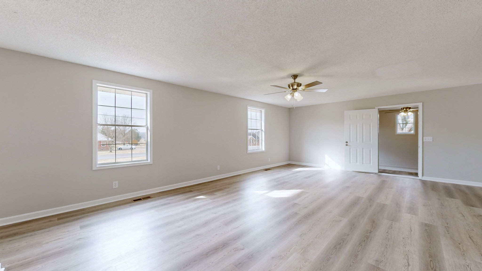 211 Freedom Drive Lebanon, TN 37087 - Photo 9 of 41 a view of an empty room with window and wooden floor