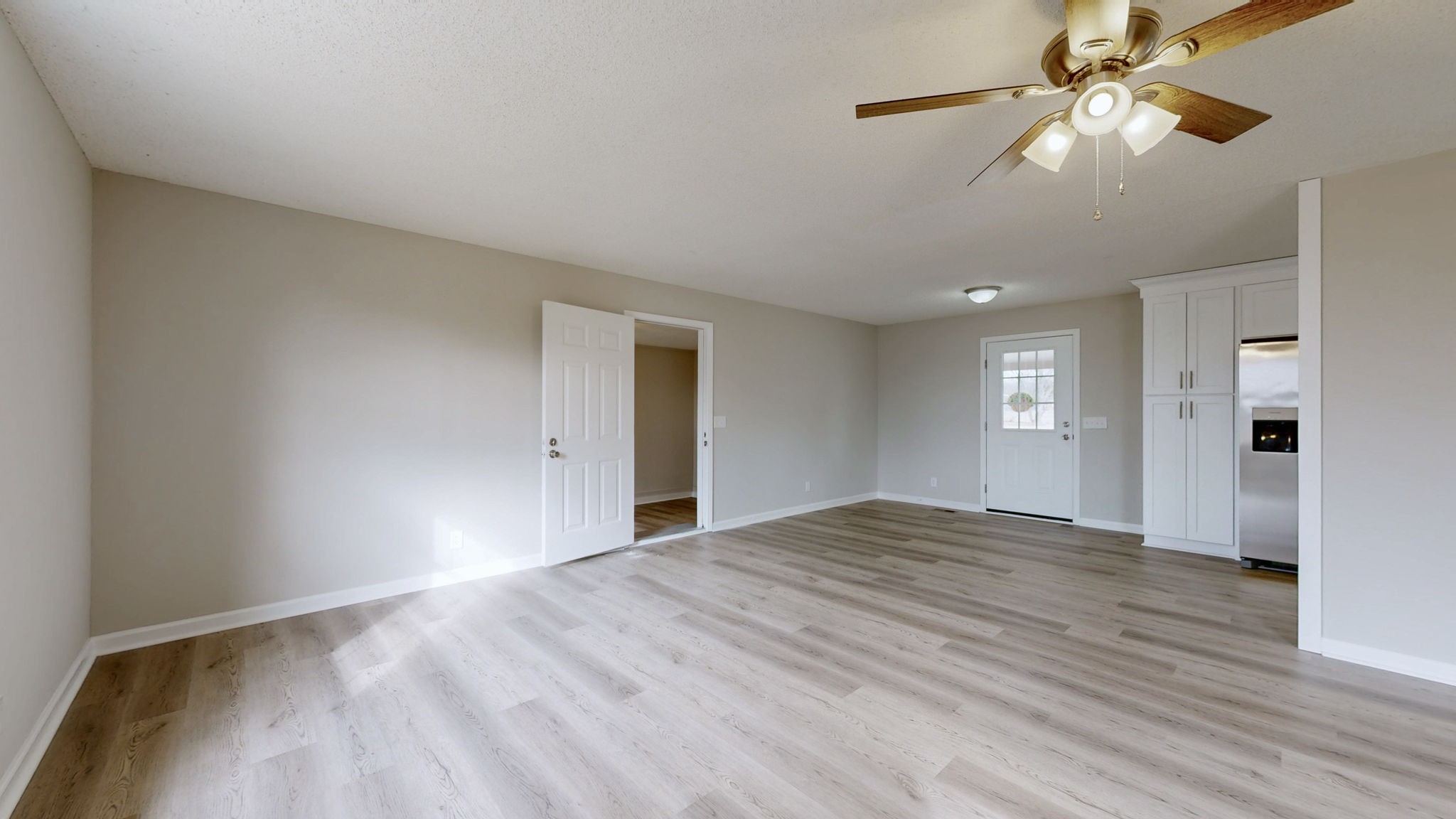 211 Freedom Drive Lebanon, TN 37087 - Photo 10 of 41 a view of empty room with window and wooden floor