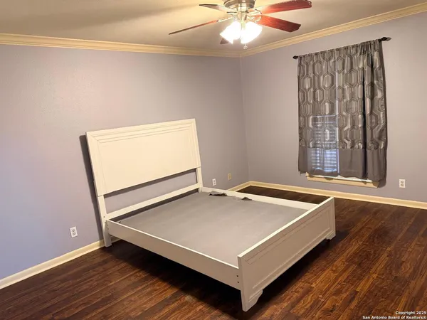 a room with pool table and window
