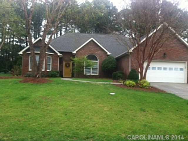 428 South Atlantic Drive Fort Mill, SC 29708 - Photo 1 of 16 a front view of a house with a garden and trees