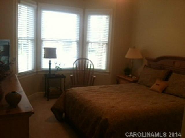 428 South Atlantic Drive Fort Mill, SC 29708 - Photo 13 of 16 a bed sitting in a bedroom next to a window