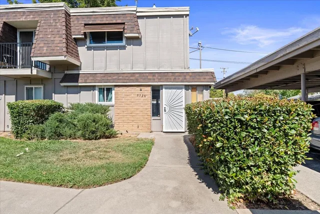front view of a house with a yard