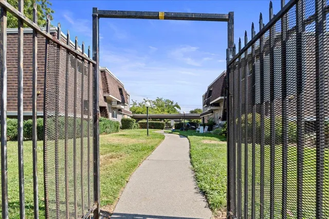 a view of a pathway of a building from a balcony