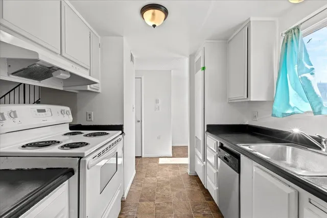 a kitchen with a stove and a sink
