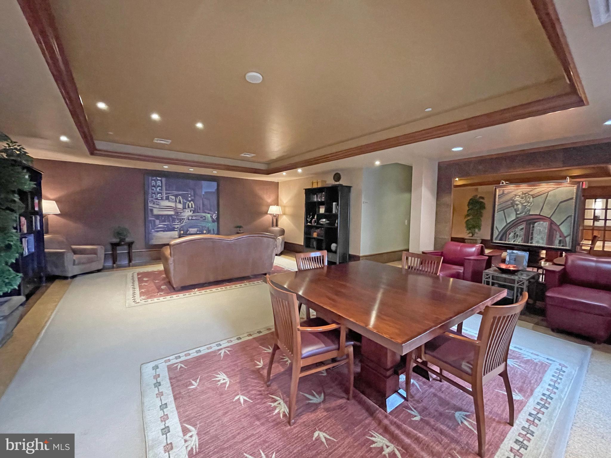 11800 Sunset Hills Road, Unit 722 Reston, VA 20190 - Photo 26 of 41 a living room with furniture a table and a potted plant