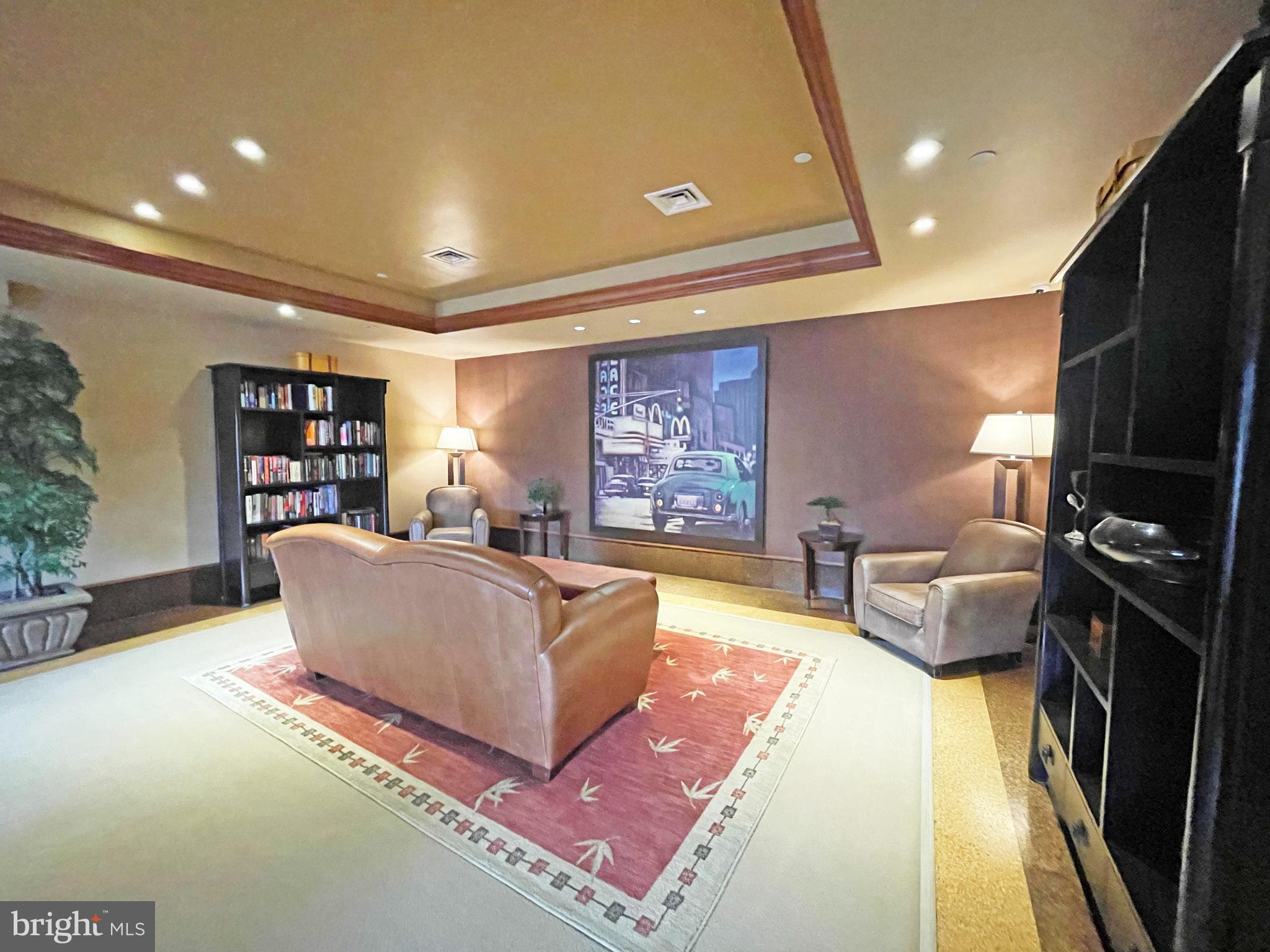 11800 Sunset Hills Road, Unit 722 Reston, VA 20190 - Photo 27 of 41 a living room with furniture and a flat screen tv
