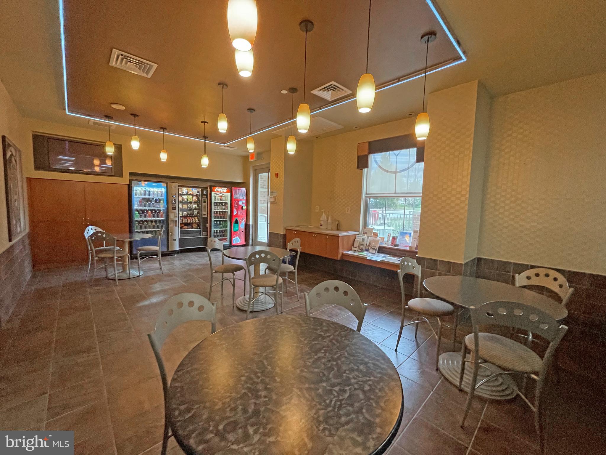 11800 Sunset Hills Road, Unit 722 Reston, VA 20190 - Photo 35 of 41 a view of a dining room with furniture