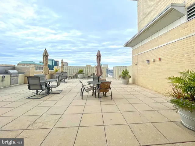 a sign that is sitting in front of flowers