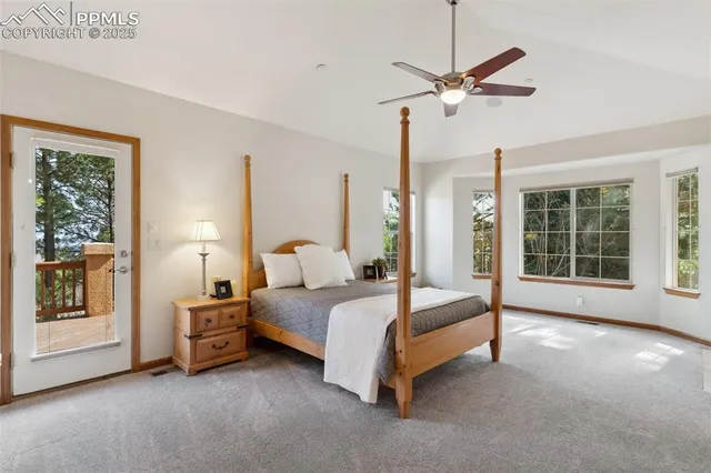 a bed room with a bed and a chandelier