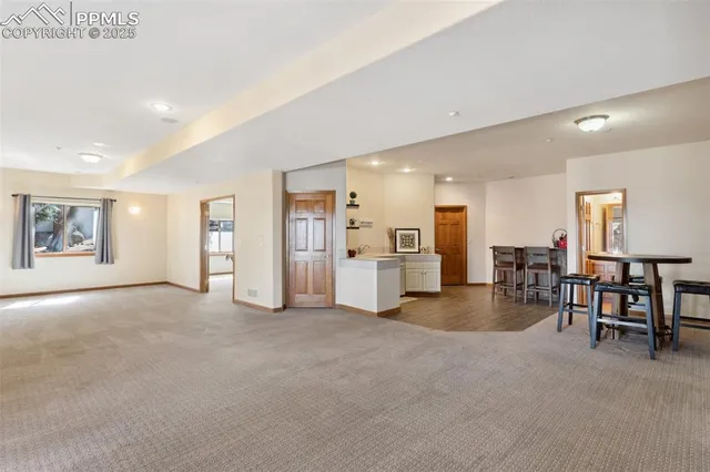 a view of a kitchen with furniture and a living room