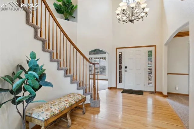 a view of an entryway with wooden floor