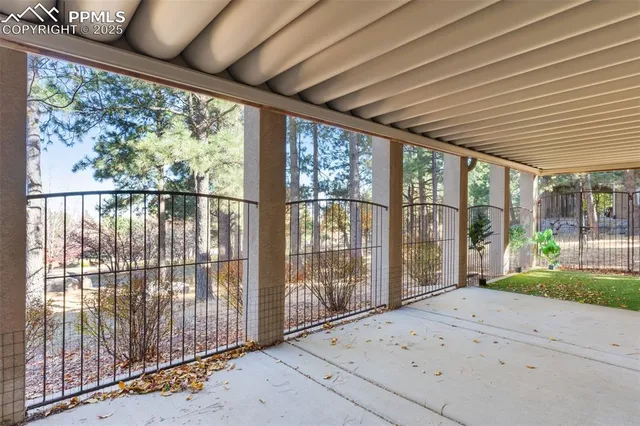 a backyard of a house with large trees