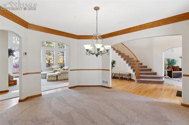 a view of a livingroom with furniture and a ceiling fan