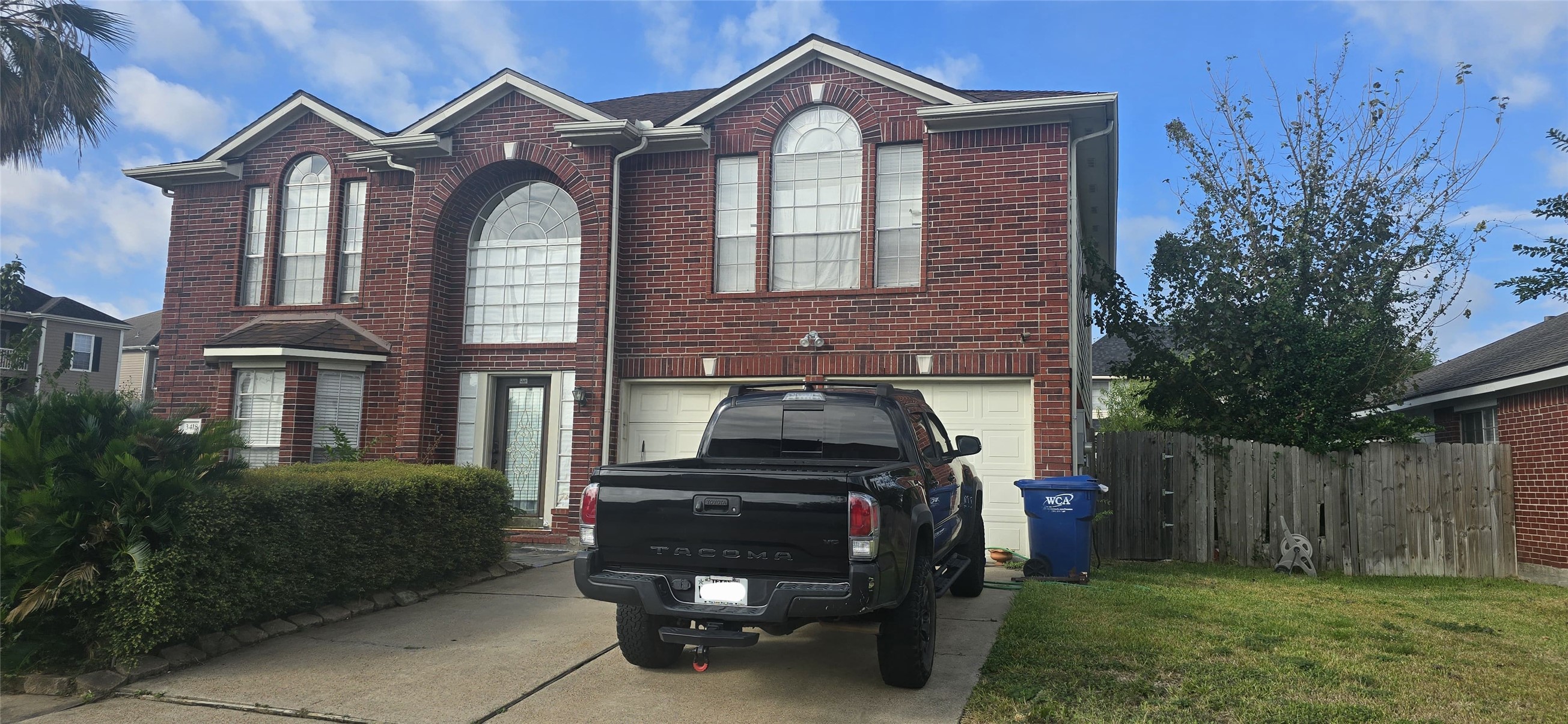 3418 Sapling Oak Drive Houston, TX 77082 - Photo 1 of 22 a front view of a house with a yard