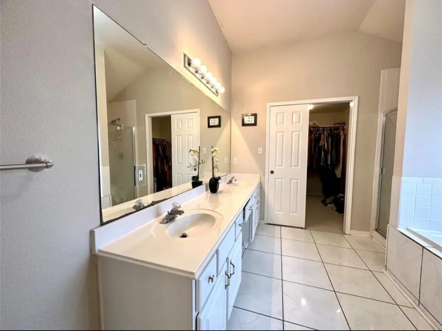 3418 Sapling Oak Drive Houston, TX 77082 - Photo 11 of 22 a bathroom with a sink a mirror and a shower