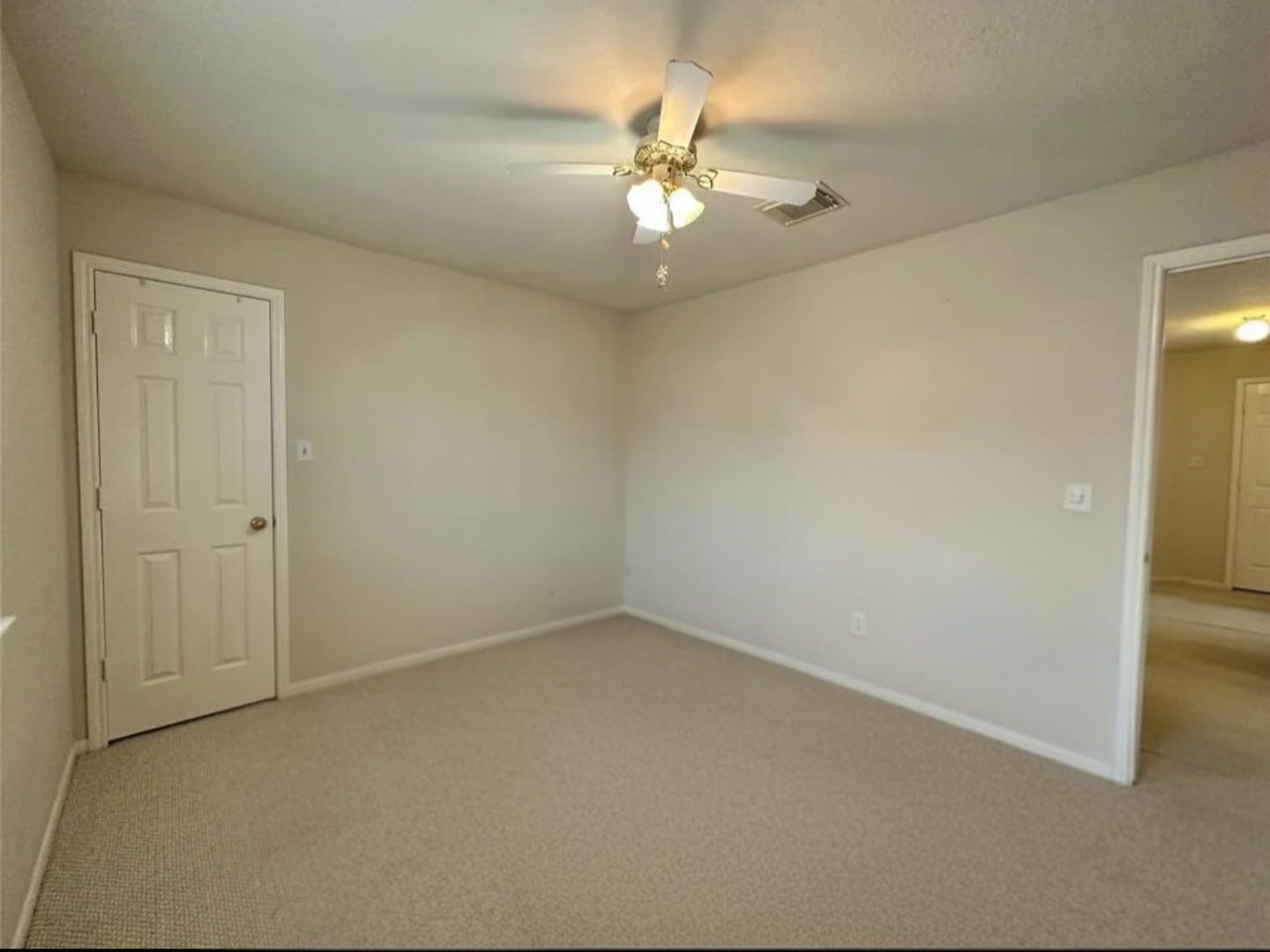 3418 Sapling Oak Drive Houston, TX 77082 - Photo 13 of 22 an empty room with a chandelier fan and a chandelier fan