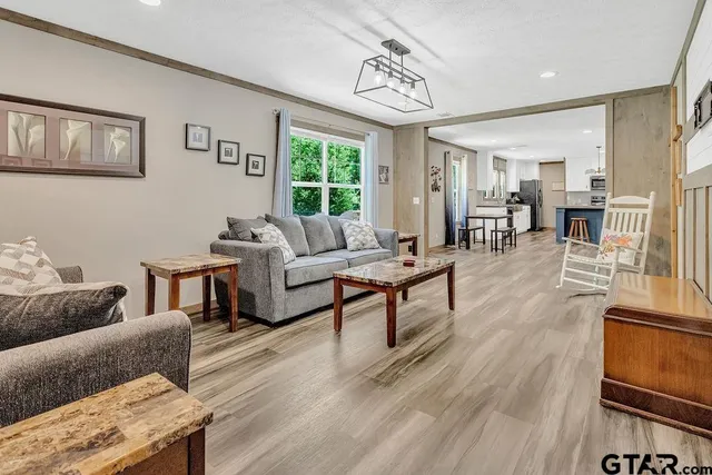 a living room with furniture and a table