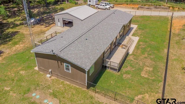 a aerial view of a house with swimming pool