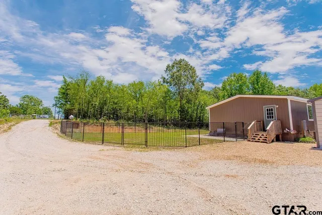 a view of outdoor space with playground and green space