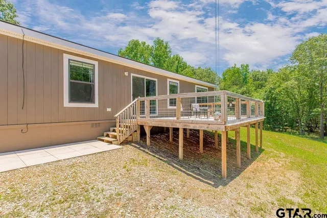 a balcony with a table and chairs
