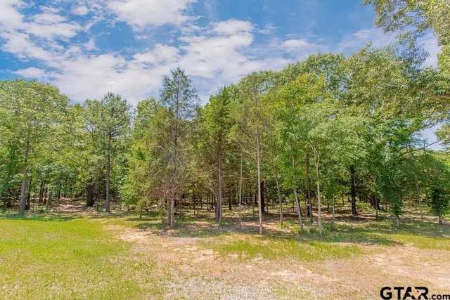 a view of a swimming pool with an outdoor space and seating area