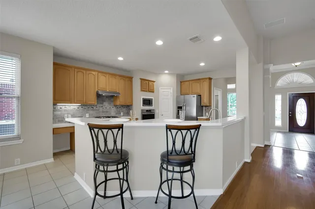 a kitchen with a table and chairs in it