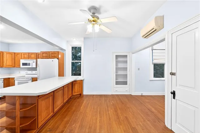 a view of an entryway with wooden floor