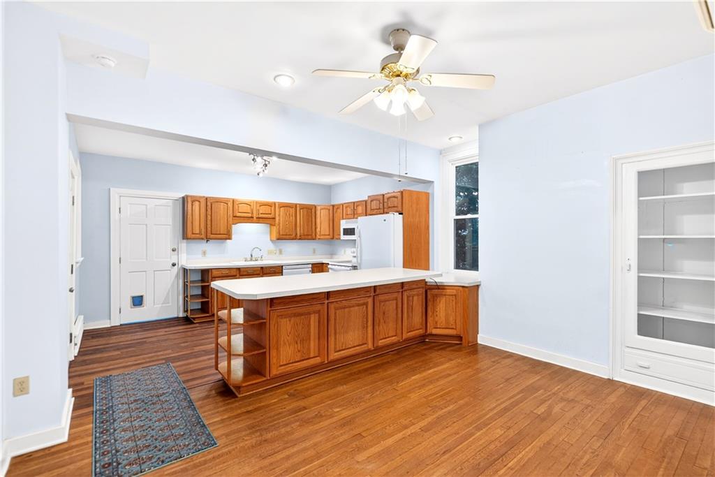 136 1/2 Chess Street Monongahela, PA 15063 - Photo 12 of 50 a view of a kitchen with wooden floor and electronic appliances