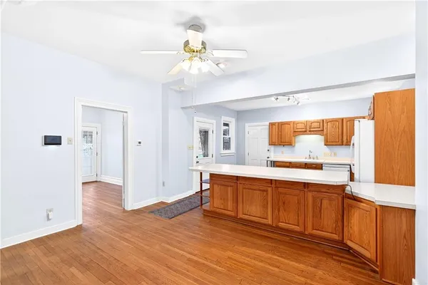 a view of a kitchen with a sink and cabinet