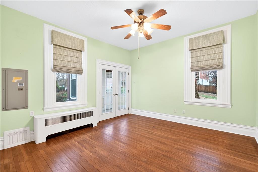 136 1/2 Chess Street Monongahela, PA 15063 - Photo 16 of 50 a view of an empty room with a window and wooden floor