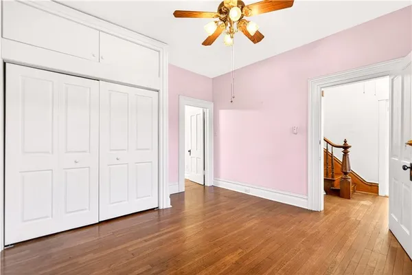 a view of an entryway with wooden floor